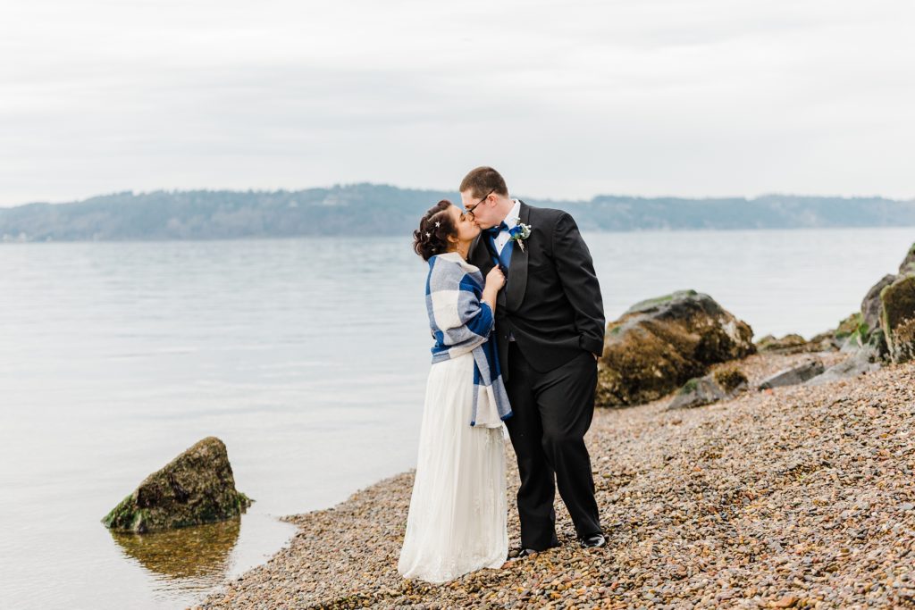 Seattle couple photographed on the rocky beach