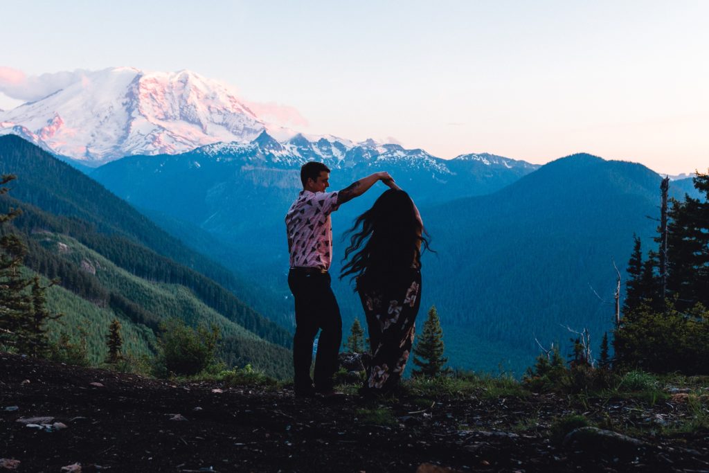 Couple dances in darkness with Mt. Rainier glowing at sunset.