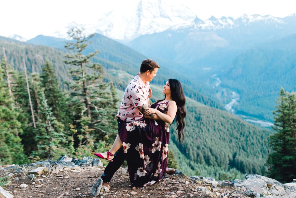 Man dips woman overlooking Mt. Rainier