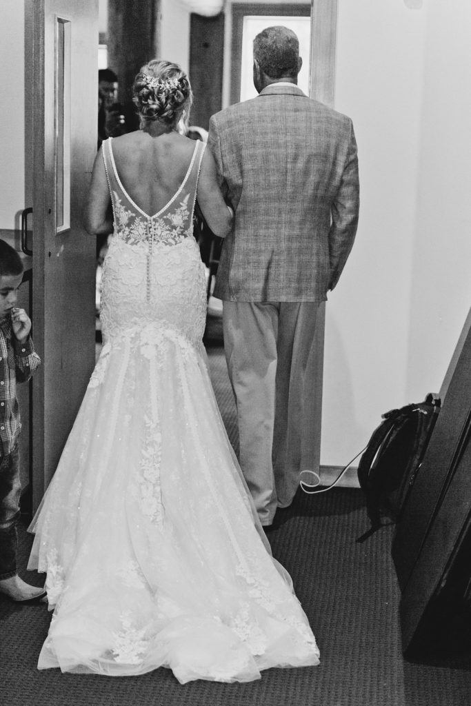 Bride from behind ready to walk into the ceremony