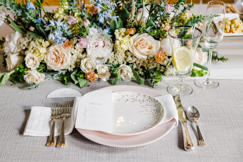 To The Girl I Loved First. Photo of a beautiful spring brunch place setting with pink and peach fresh florals.